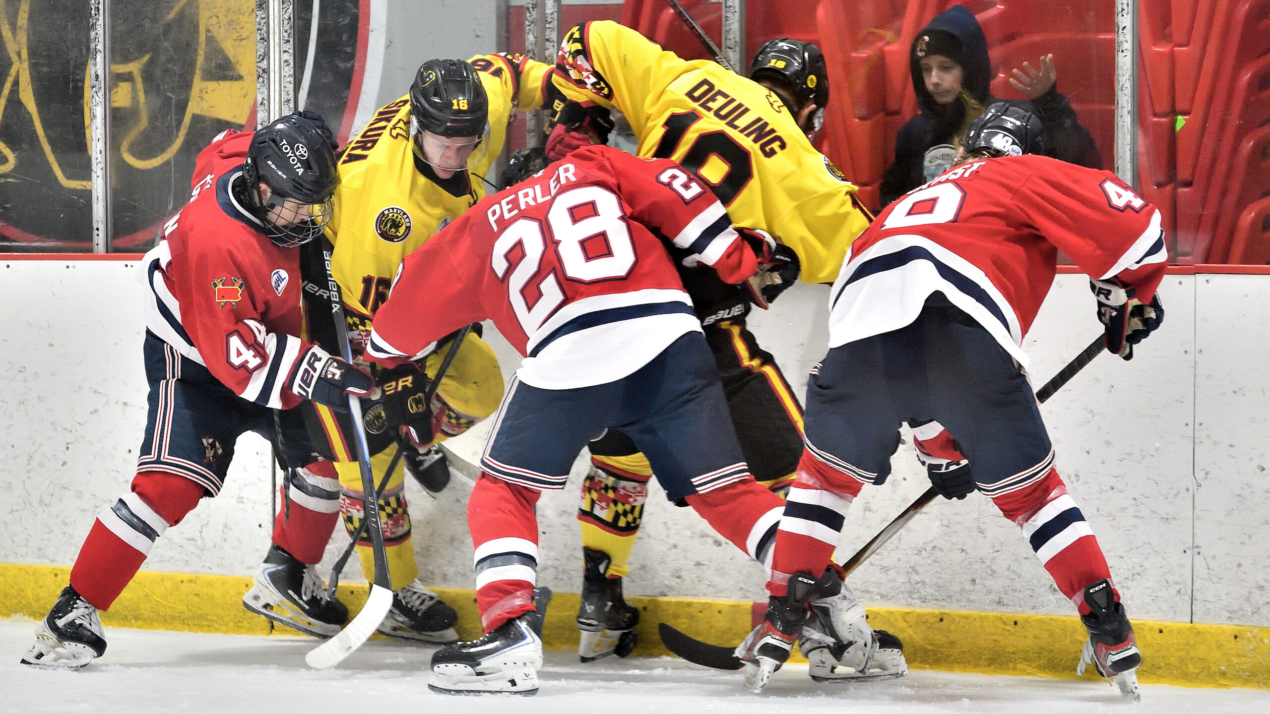 Deuling battles for puck against Johnstown